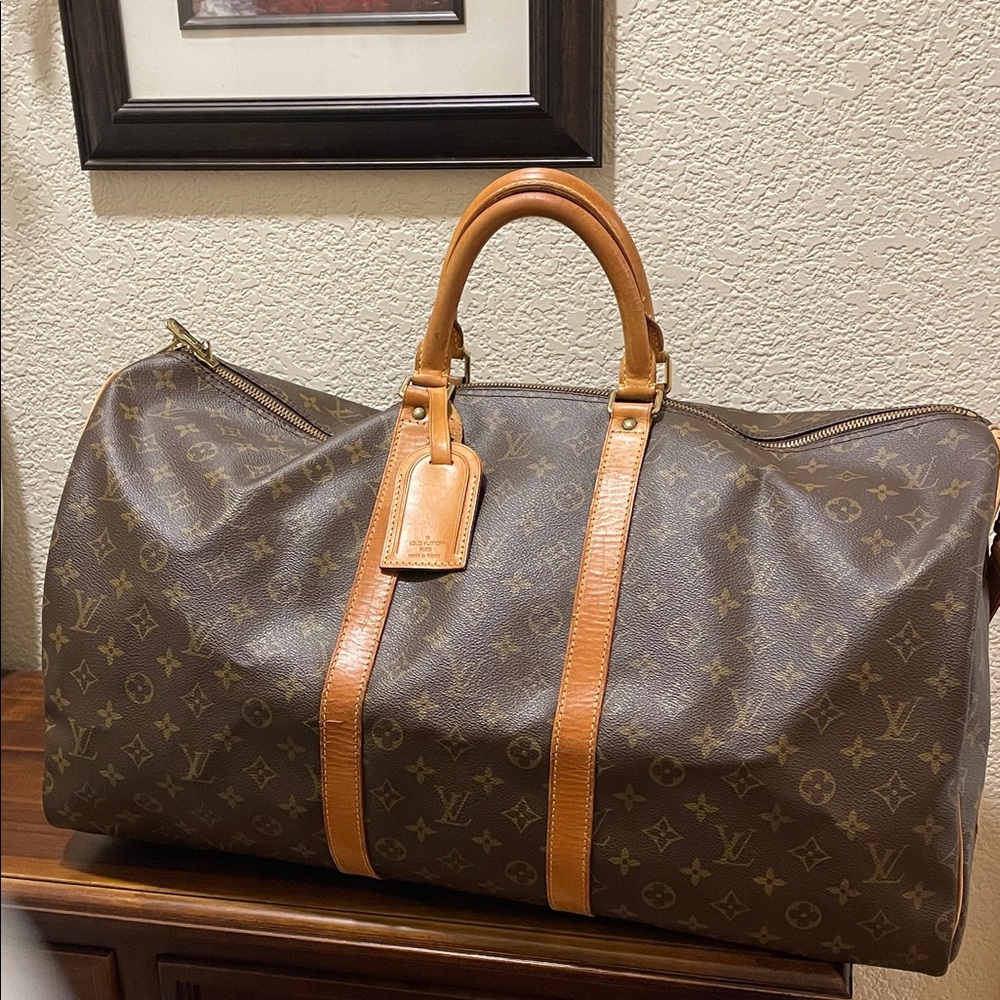 Authenticity Guaranteed Louis Vuitton Monogram Duffel Bag